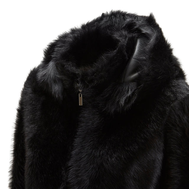 Cappotto nero da donna in shearling reversibile a pelo lungo